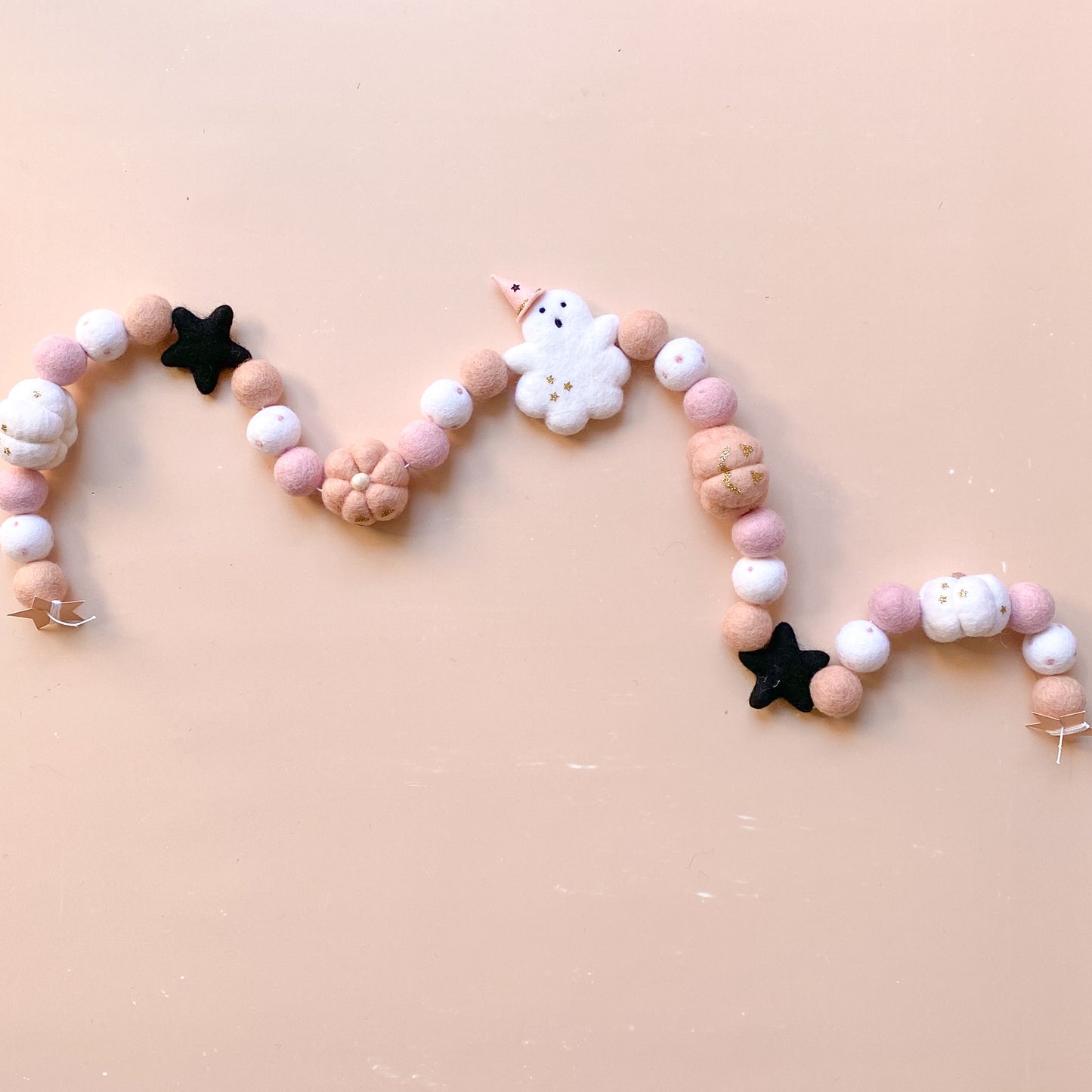 halloween felt garland with ghost, witch hat, pumpkins in soft pink colour