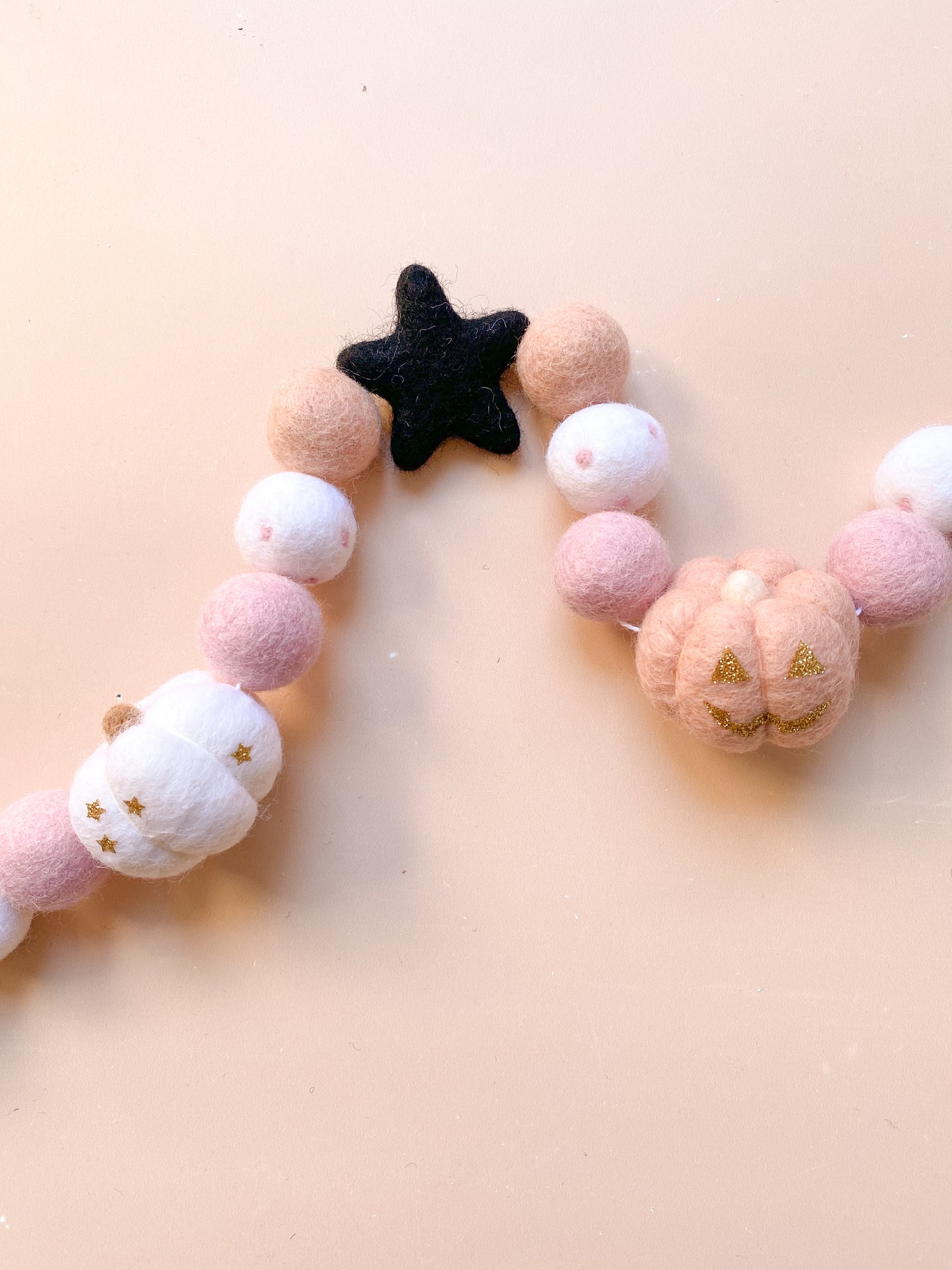 halloween felt garland with ghost, witch hat, pumpkins in soft pink colour