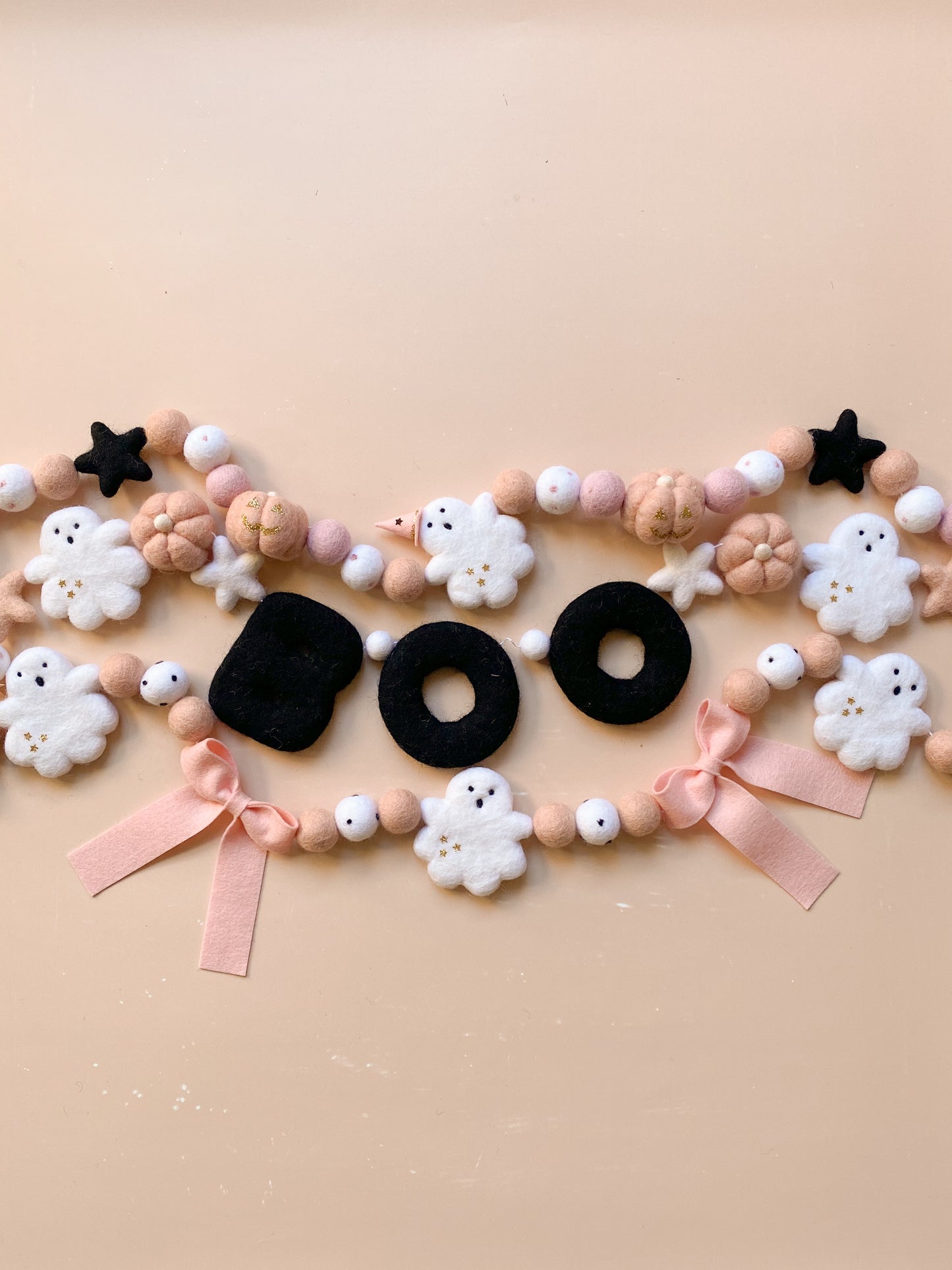 halloween felt garland with ghost, witch hat, pumpkins in soft pink colour