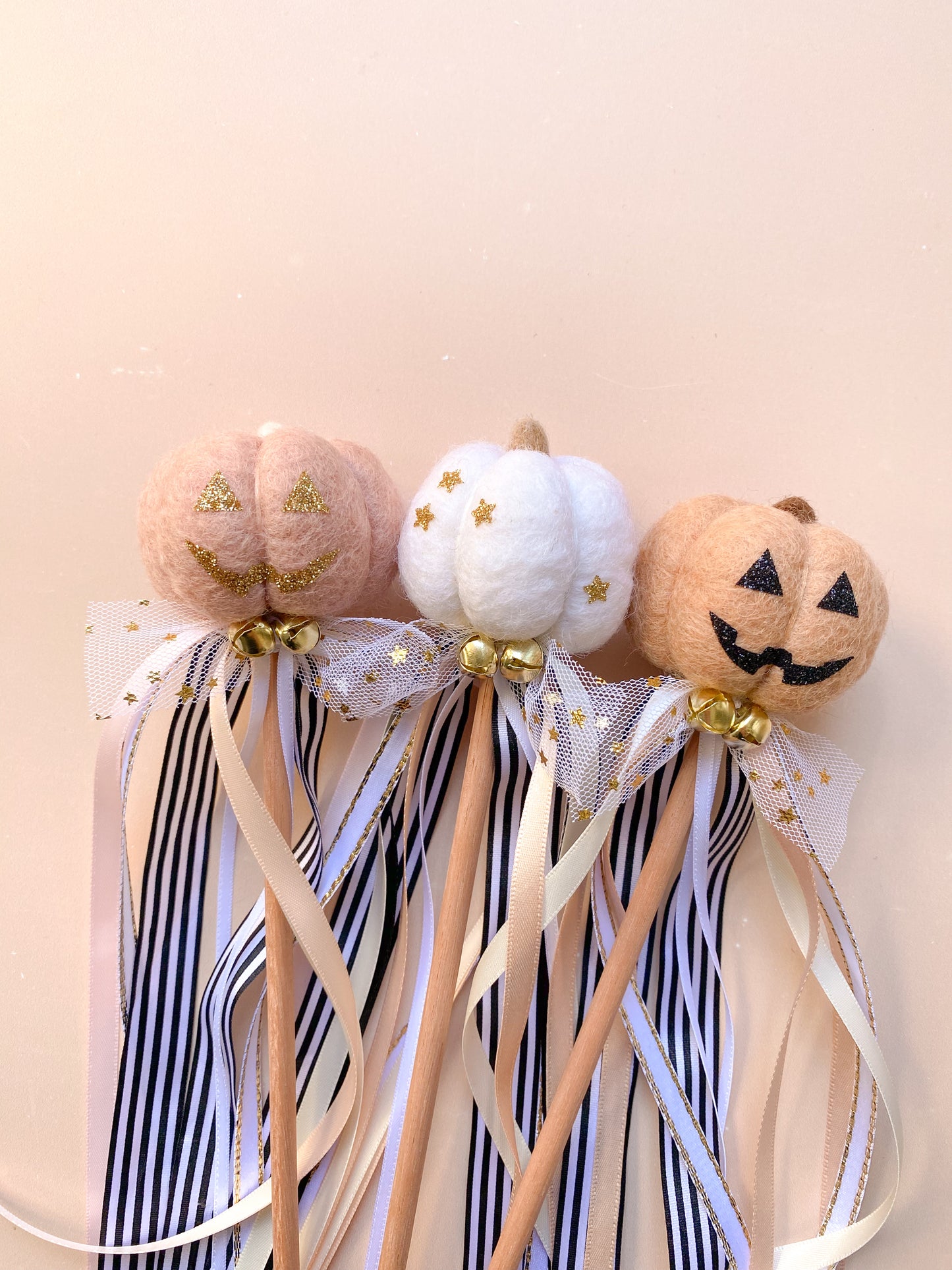 halloween pumpkin wands on sticks with ribbons
