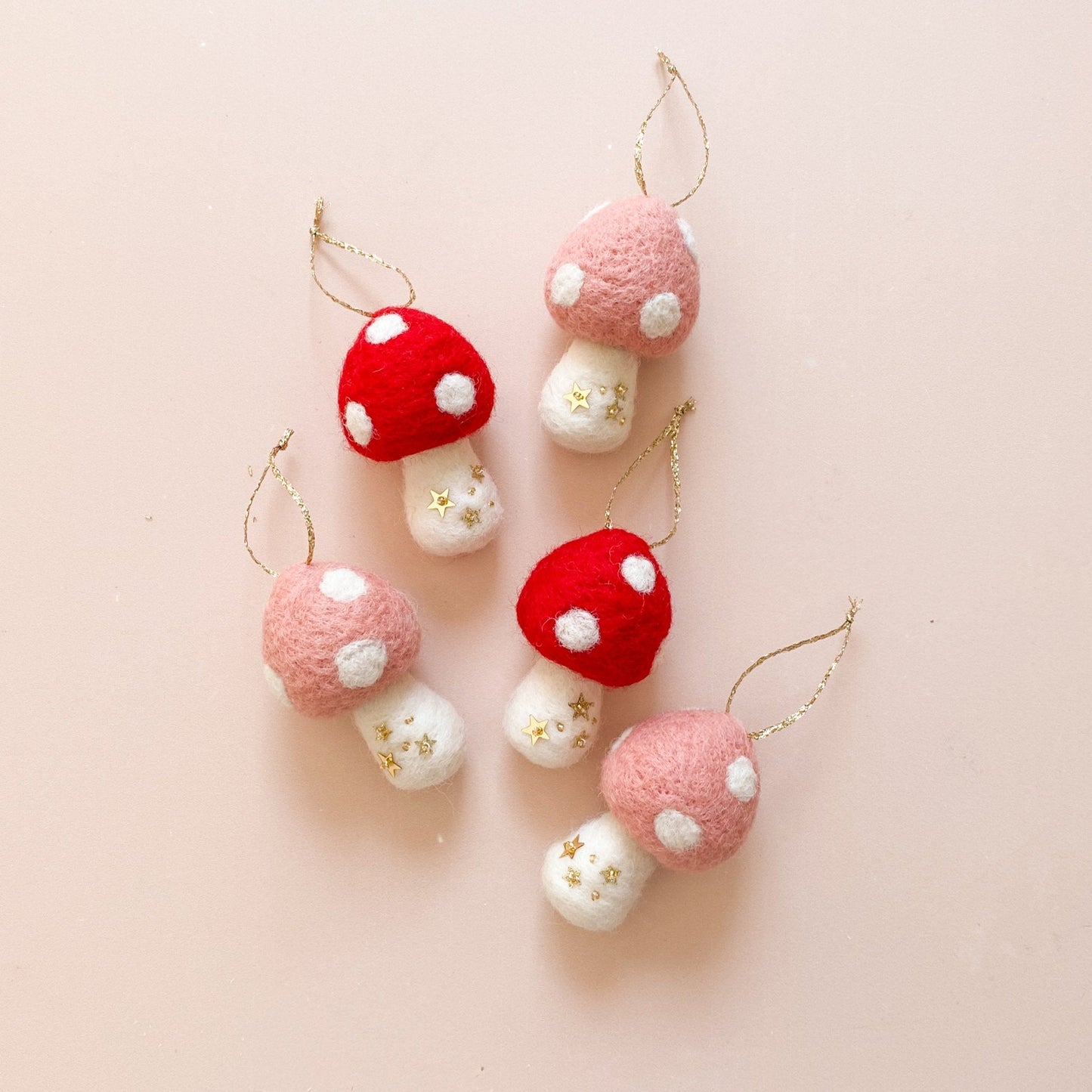 wool felted mushroom Christmas ornament with hand sewn star sequins details
