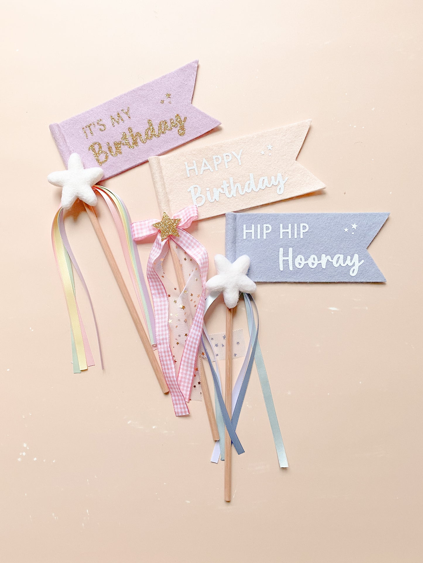 Decorative birthday banners with ribbons and stars