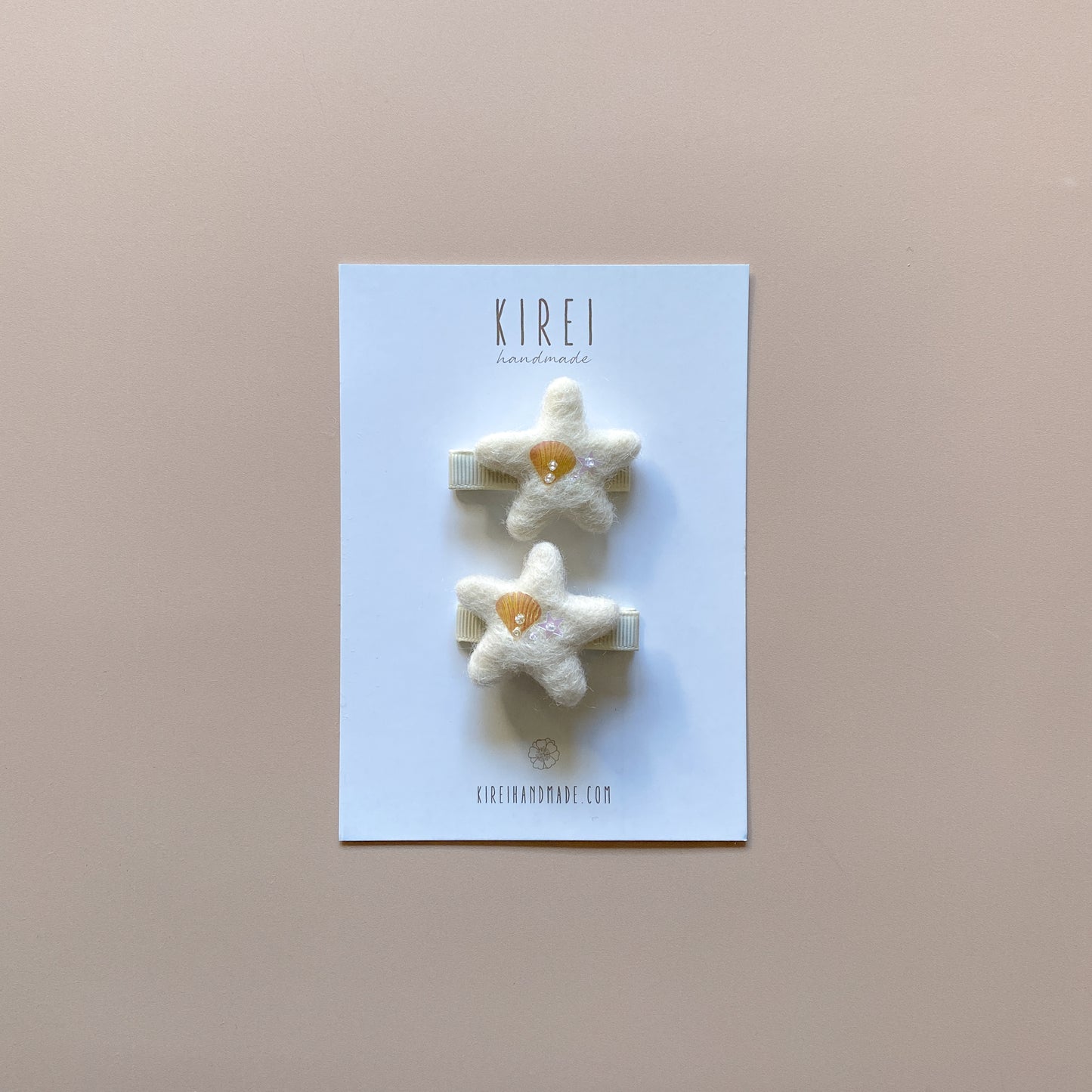 Handmade starfish hair clips with sequins.