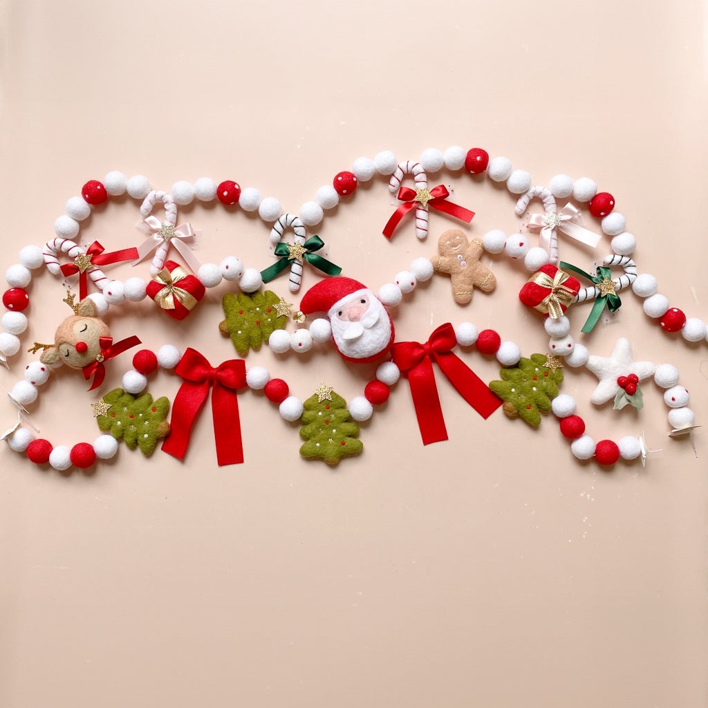Decorative felted wool Christmas garlands in red, white and green hues
