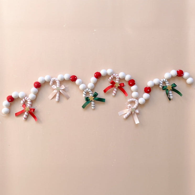 Decorative garland with red, green and pink candy cane