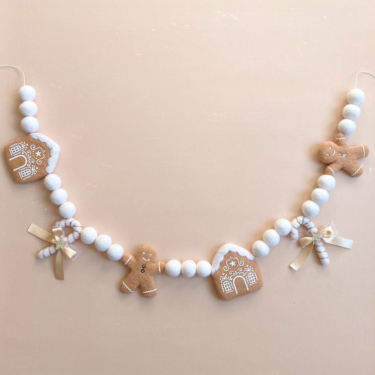 Decorative felt garland with gingerbread-themed ornaments 