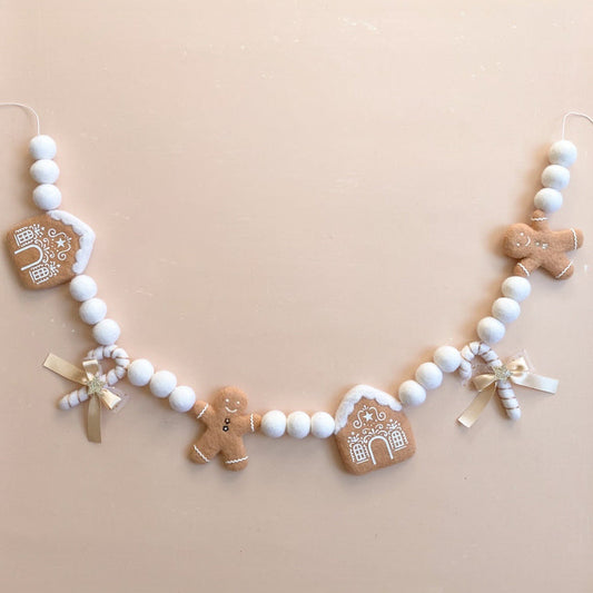 Decorative felt garland with gingerbread-themed ornaments 