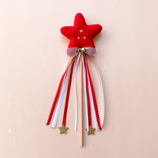 Red star-shaped wand with ribbons 