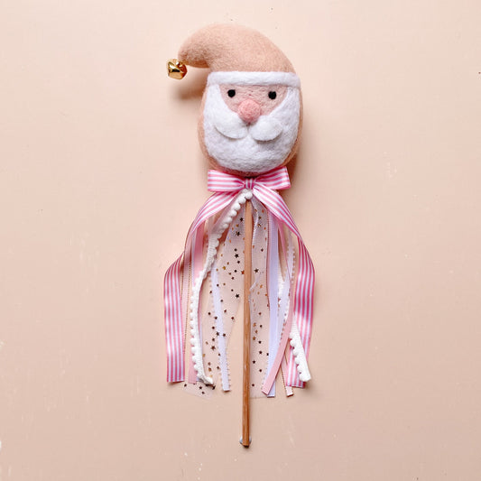 Decorative wand with a wool felted Santa face and pink ribbon 