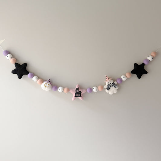 A pastel-colored halloween felt garland 