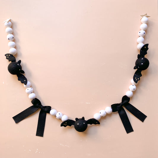 decorative garland with black bats and bows
