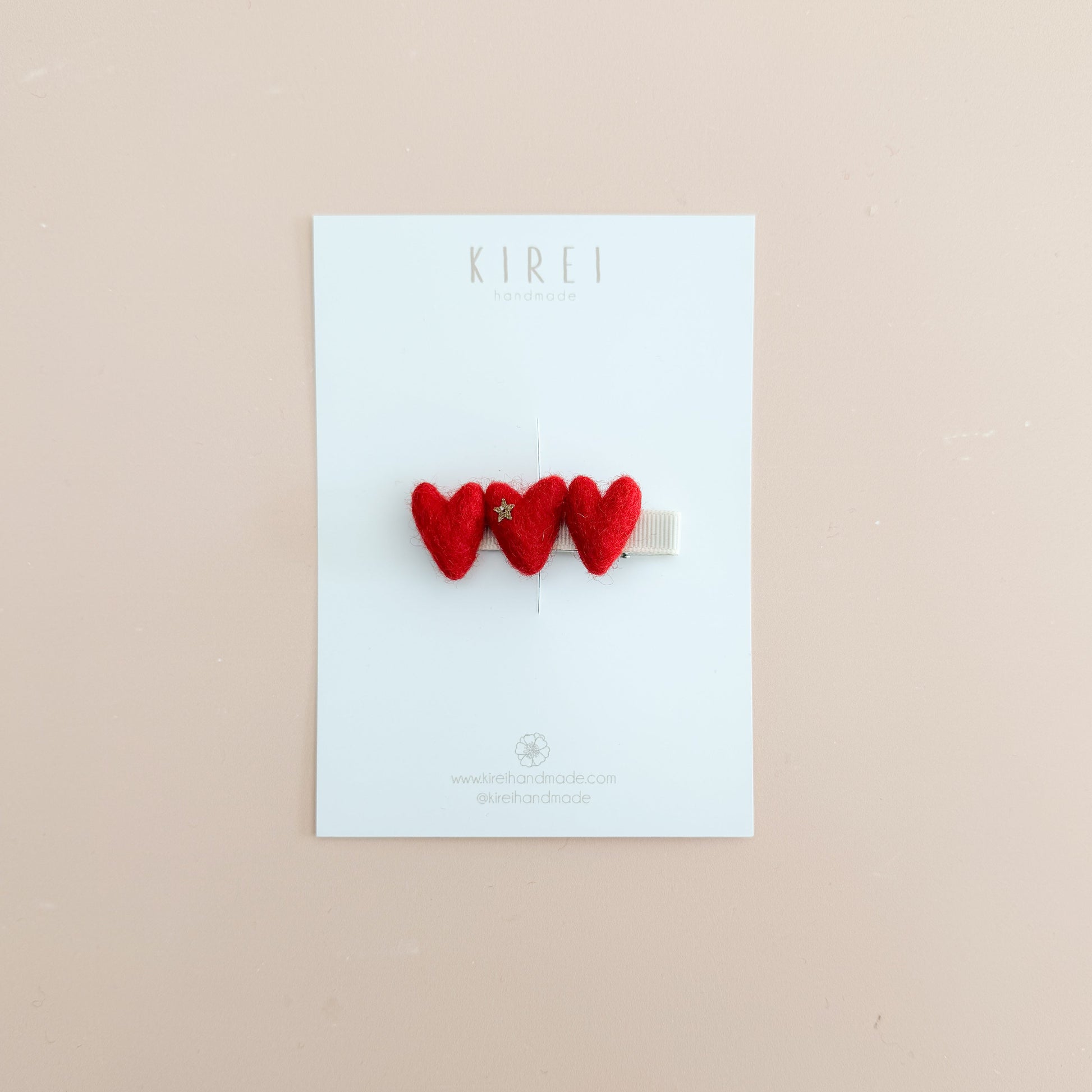 Three wool felted red heart-shaped hair clips 