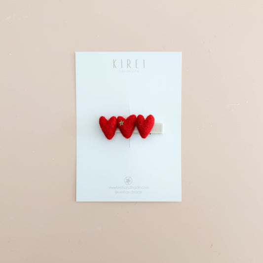 Three wool felted red heart-shaped hair clips 